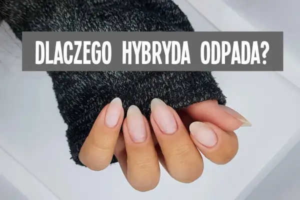 Dłonie w szarym swetrze, z widocznymi paznokciami. Napis: "DLACZEGO HYBRYDA ODPADA?". Nic mi się nie trzyma na paznokciach?